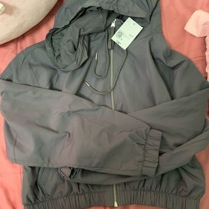 Cropped forever 21 gray windbreaker brand new with tags.